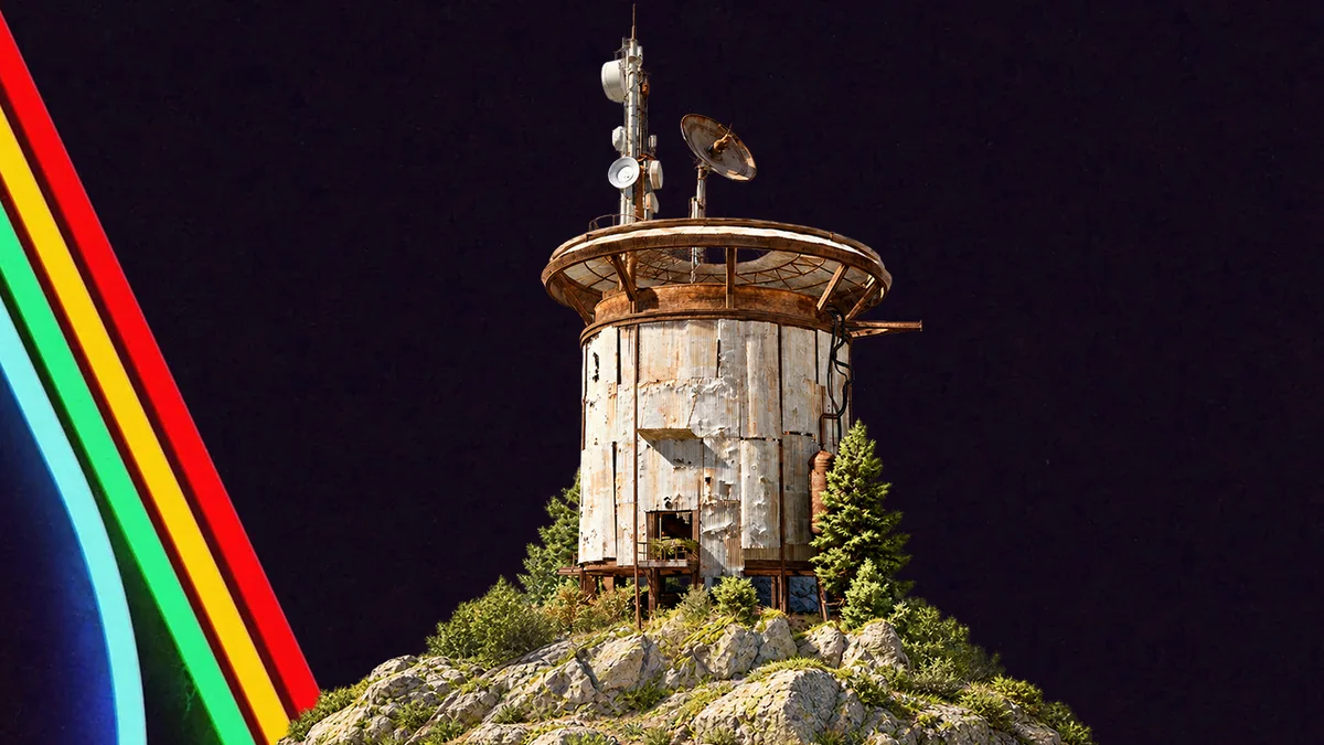 Cylindrical Outpost tower with antennas and satellite dishes on a rocky green hill